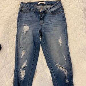 Distressed denim jeans